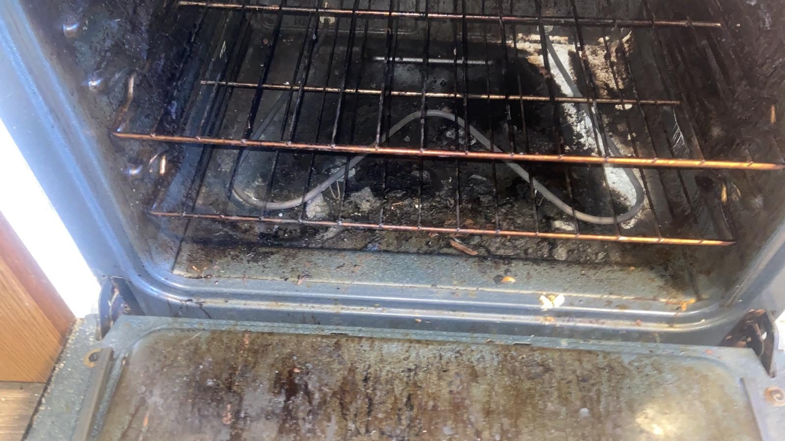 Apartment oven before Levdok unit turn cleaning — grease and buildup